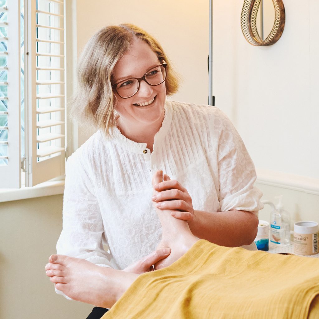 Sarah Gillespie giving a reflexology treatment